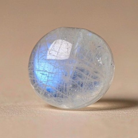 Blue-flash moonstone bead, macro photo